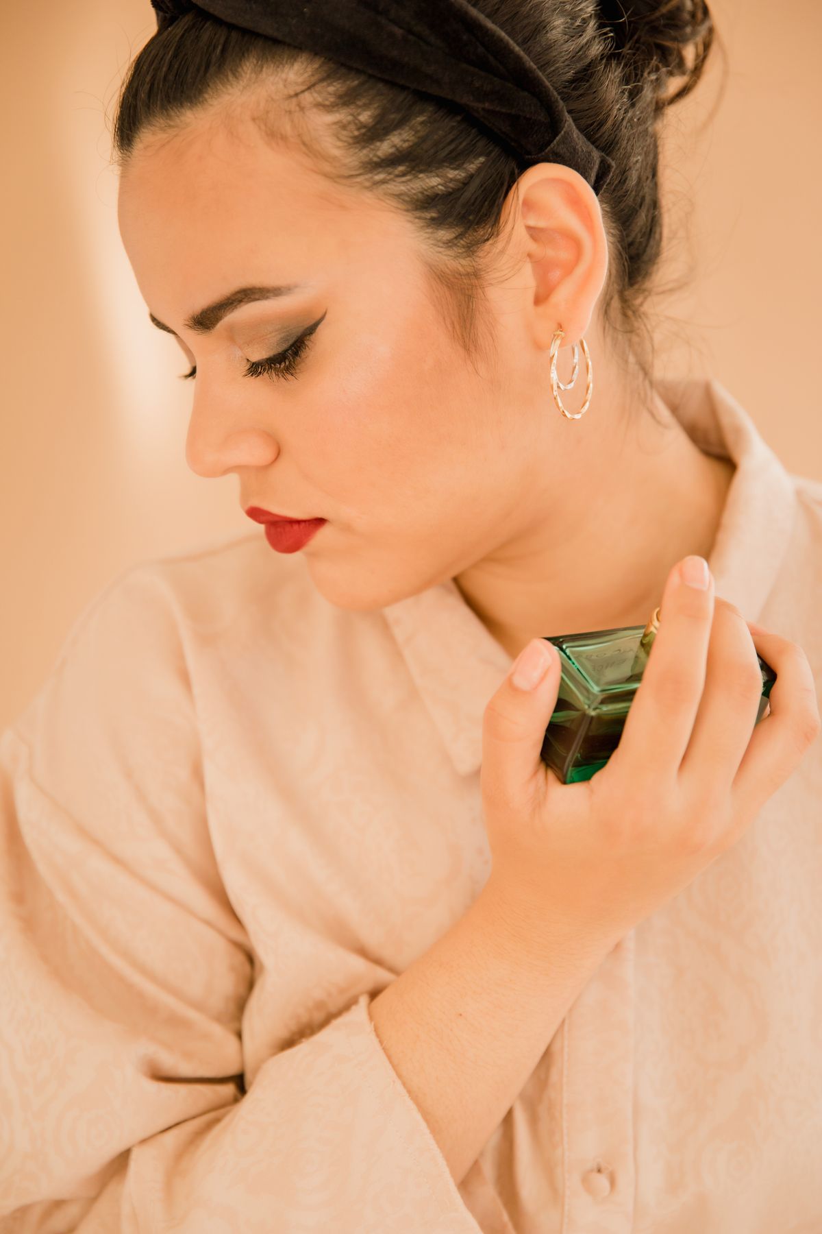 Woman holding a perfume bottle